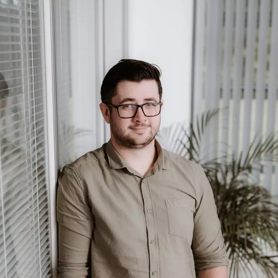 Rob Cipolla standing beside a window